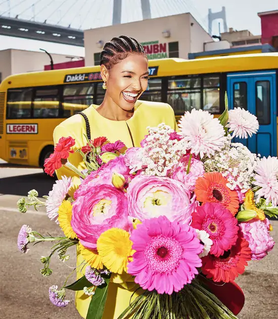Joyful portrait with flowers in your city
